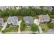 A high altitude view of the home with a landscaped lawn in a neighborhood with manicured lawns and mature trees at 1565 Briergate Dr, Duluth, GA 30097