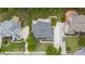 A high altitude view of the home with a landscaped lawn in a neighborhood with mature trees at 1565 Briergate Dr, Duluth, GA 30097