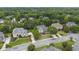 A high altitude view of the home with a landscaped lawn in a neighborhood with mature trees at 1565 Briergate Dr, Duluth, GA 30097