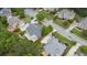 Aerial view of home featuring a large deck, lush landscaping, and mature trees at 1565 Briergate Dr, Duluth, GA 30097