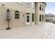 Spacious back deck with neutral tones, featuring an umbrella and access to backyard at 1565 Briergate Dr, Duluth, GA 30097