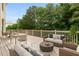 Outdoor living space on a back deck with wicker seating and a wooded view at 1565 Briergate Dr, Duluth, GA 30097