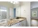 Bright bathroom featuring a vanity with granite counters and hardwood floors at 1565 Briergate Dr, Duluth, GA 30097