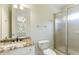 Bathroom with granite vanity, standing shower, and an open doorway at 1565 Briergate Dr, Duluth, GA 30097
