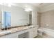 Modern bathroom with dual sinks, granite countertops, tile floors, and a walk-in shower at 1565 Briergate Dr, Duluth, GA 30097