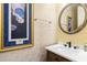 Elegant powder room featuring a round mirror, modern fixtures, and textured wallpaper at 1565 Briergate Dr, Duluth, GA 30097