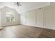 Spacious bedroom features decorative molding, large arched windows and lots of natural light at 1565 Briergate Dr, Duluth, GA 30097