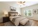 Relaxing main bedroom boasts a large window, soft lighting, and neutral tones for a comfortable space at 1565 Briergate Dr, Duluth, GA 30097