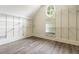 Large walk-in closet with custom shelving and updated gray flooring at 1565 Briergate Dr, Duluth, GA 30097