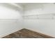 Walk-in closet featuring wood flooring and wire shelving at 1565 Briergate Dr, Duluth, GA 30097