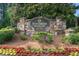Beautiful stone entrance sign for Stonebrier at Sugarloaf with colorful flowerbeds at 1565 Briergate Dr, Duluth, GA 30097
