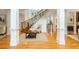 Grand foyer with hardwood floors, staircase, and detailed trim work at 1565 Briergate Dr, Duluth, GA 30097