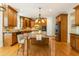 Gourmet kitchen featuring custom cabinets, granite counters, stainless appliances, and a spacious center island at 1565 Briergate Dr, Duluth, GA 30097