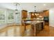Spacious kitchen with granite island, hardwood floors, and stainless steel appliances at 1565 Briergate Dr, Duluth, GA 30097