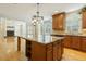 Gourmet kitchen featuring a granite island, stainless steel appliances, and ample cabinet space at 1565 Briergate Dr, Duluth, GA 30097