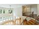 Open-concept living space featuring hardwood floors, a cozy fireplace, and staircase at 1565 Briergate Dr, Duluth, GA 30097