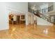 Bright living room features an open layout to the kitchen, hardwood floors and an elegant staircase at 1565 Briergate Dr, Duluth, GA 30097