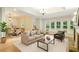 Inviting living room boasts many windows, wood floors, and a fireplace, flowing into dining area at 1565 Briergate Dr, Duluth, GA 30097