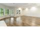 Bright, open living room with hardwood floors, recessed lighting, and large windows at 1565 Briergate Dr, Duluth, GA 30097