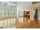 Bright living room boasts hardwood floors, large windows, and an open layout into the gourmet kitchen at 1565 Briergate Dr, Duluth, GA 30097