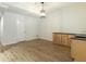 Bright living room with wood flooring and light wood cabinets with dark countertop at 1565 Briergate Dr, Duluth, GA 30097