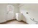 Mud room complete with door to exterior, utility sink and storage, and tile flooring at 1565 Briergate Dr, Duluth, GA 30097