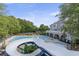 Waterpark-style community pool featuring a kiddie pool, slide, and sunbathing deck at 1565 Briergate Dr, Duluth, GA 30097