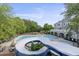 Waterpark-style community pool featuring a kiddie pool, slide, and sunbathing deck at 1565 Briergate Dr, Duluth, GA 30097