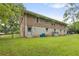 Large backyard with brick home and spacious green lawn and chain link fence at 2720 Birchwood Sw Way, Marietta, GA 30060