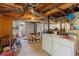 Unfinished basement with exposed ceiling, white cinder block walls, and paint cans at 2720 Birchwood Sw Way, Marietta, GA 30060