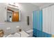Compact bathroom with classic white tile, shower, and vanity at 2720 Birchwood Sw Way, Marietta, GA 30060