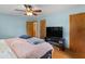 Bright bedroom with ceiling fan, closet, and wood floors at 2720 Birchwood Sw Way, Marietta, GA 30060