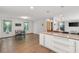 Open concept kitchen and dining room area with modern appliances and ample counter space at 2720 Birchwood Sw Way, Marietta, GA 30060