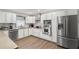 Modern kitchen features stainless steel appliances and white cabinetry at 2720 Birchwood Sw Way, Marietta, GA 30060