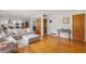 Spacious living room with hardwood floors leads into the modern kitchen, great for entertaining at 2720 Birchwood Sw Way, Marietta, GA 30060