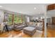 Bright living room featuring hardwood floors and open floor plan to the modern kitchen at 2720 Birchwood Sw Way, Marietta, GA 30060