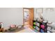 Organized playroom with colorful storage and a glimpse of the living area at 2720 Birchwood Sw Way, Marietta, GA 30060