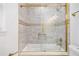 Bathroom showcasing a glass shower enclosure, tiled walls, and a built-in niche at 2760 Swansea Ct, College Park, GA 30349