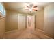 Bedroom with a ceiling fan, neutral carpet, and large closet for ample storage at 3467 Pinehill Dr, Decatur, GA 30032