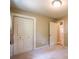 Bedroom with a standard closet door; it has neutral colored walls and beige carpet at 3467 Pinehill Dr, Decatur, GA 30032