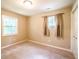 Cozy bedroom features neutral walls, plush carpeting, and natural light from the window at 3467 Pinehill Dr, Decatur, GA 30032