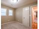 Neutral paint colors and beige carpet. This bedroom has two windows and standard closet at 3467 Pinehill Dr, Decatur, GA 30032