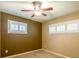 Cozy bedroom features neutral carpet, ceiling fan, and plenty of natural light at 3467 Pinehill Dr, Decatur, GA 30032