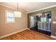 Dining room featuring hardwood floors that opens to an updated kitchen at 3467 Pinehill Dr, Decatur, GA 30032