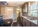 Well-designed kitchen with stainless sink, granite counters, and access to laundry room at 3467 Pinehill Dr, Decatur, GA 30032