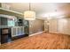 Open-concept living space showcasing hardwood floors connecting to the updated kitchen at 3467 Pinehill Dr, Decatur, GA 30032