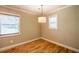 Well-lit room features hardwood floors, modern pendant lighting, and neutral paint at 3467 Pinehill Dr, Decatur, GA 30032
