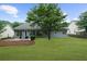 Backyard of home featuring a well maintained lawn and patio sitting area at 4178 Mcever Park Dr, Acworth, GA 30101