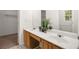 Bathroom featuring double sinks, a large mirror, and a doorway to the closet at 4178 Mcever Park Dr, Acworth, GA 30101