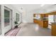 Inviting kitchen with granite countertops, a practical kitchen island, and an adjacent entry way with tiled floors at 4178 Mcever Park Dr, Acworth, GA 30101